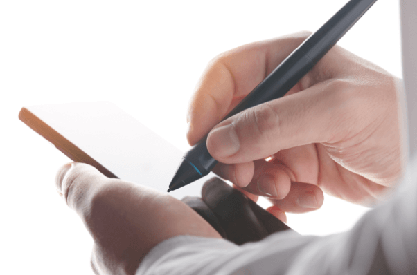 person signing a document on their phone