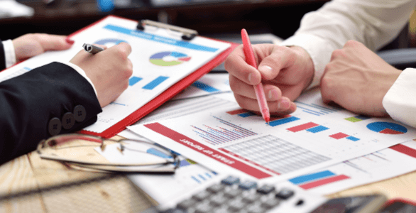 business people working in stacks of paperwork