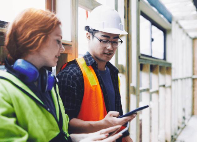 Two field service workers using an app